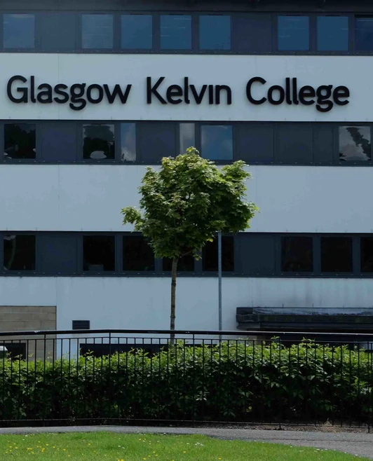 Side view of Glasgow Kelvin College Easterhouse Campus featuring the building’s modern architecture and glass-panelled exterior. Side view of Glasgow Kelvin College Easterhouse Campus featuring the building’s modern architecture and glass-panelled exterior.